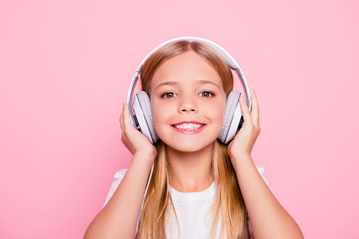 Style playlist leisure lifestyle weekend positive glamour concept. Close up portrait of cute lovely sweet tender adorable girl listening to favorite song using headphones isolate don pink background