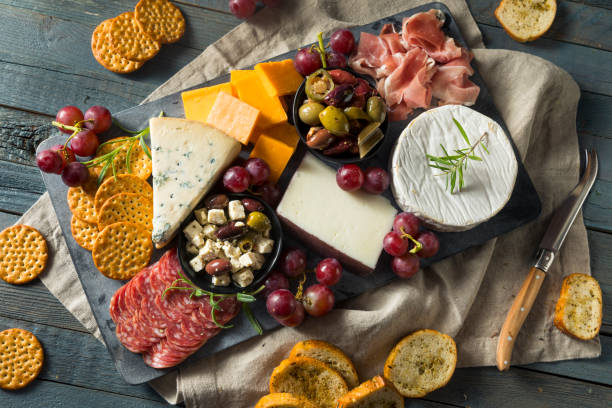 Gourmet Fancy Charcuterie Board Gourmet Fancy Charcuterie Board with Meat Cheese and Grapes charcuterie stock pictures, royalty-free photos & images