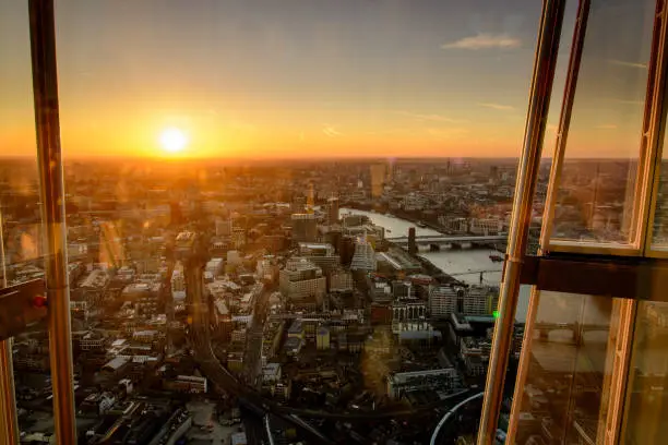 Photo of Sunset view over the city centre of London (UK) from the viewing platform on top of the Shard, the tallest building in Western Europe.