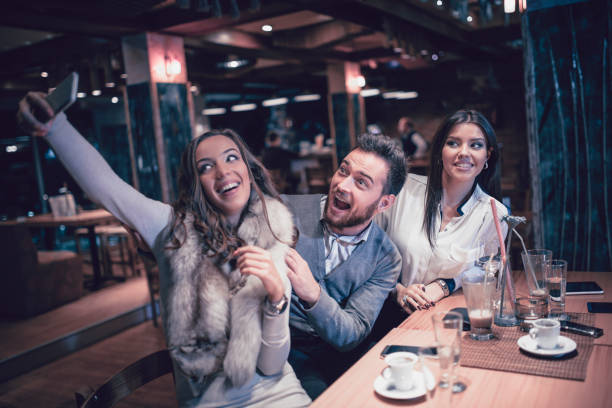 istock Group Of Friends Taking Selfie At Coffee Bar 933836772