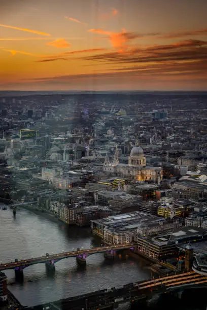 Photo of Sunset view over the city centre of London (UK) from the viewing platform on top of the Shard.