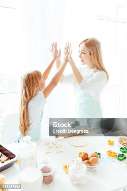 Maternity Parenthood White Light Win Winner Tasty Finished Complete Concept Vertical Side View Photo Of Cheerful Excited Cute Lovely Sweet Charming Mommy Small Kid Giving Highfive In Light Kitchen Stock Photo - Download Image Now
