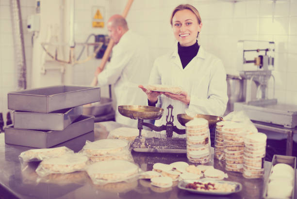 istock Worker standing near table in manufacture 933837538