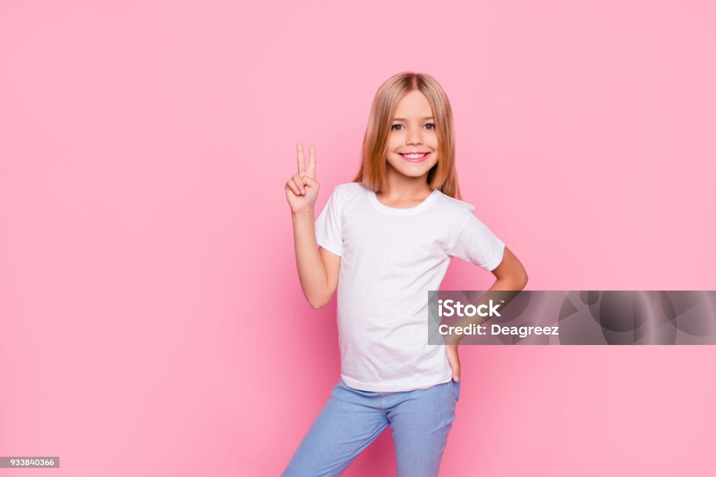 Fun joy enjoy people person funtime concept. Portrait of cute lovely carefree confident sweet adorable beautiful girl in casual modern outfit demonstrating v-sign isolated on pink background Girls Stock Photo