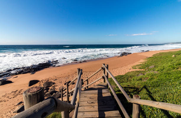 istock Empty Wooden Walkway Leading onto Beach in South Africa 933843890