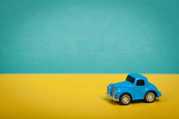 istock Cute blue car on green background. Travel concept 933847686