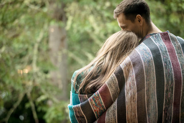 istock Young couple enjoying camping in the forest 933850692