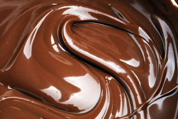 istock Melting chocolate, melted delicious chocolate for praline icing confectionery 933853372