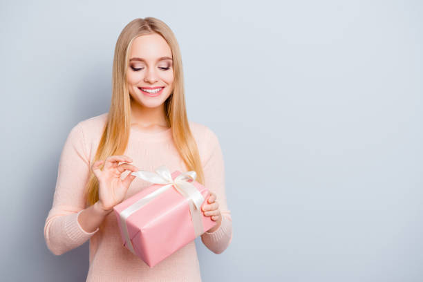 Style stylish trend people international person rest relax christmas xmas new year concept. Portrait of charming attractive wondered delightful cute girl opening giftbox isolated on gray background Style stylish trend people international person rest relax christmas xmas new year concept. Portrait of charming attractive wondered delightful cute girl opening giftbox isolated on gray background delightful stock pictures, royalty-free photos & images