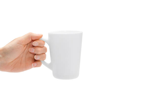 istock woman hand holding white cup. Isolated on white background. copy space, template. 933856806
