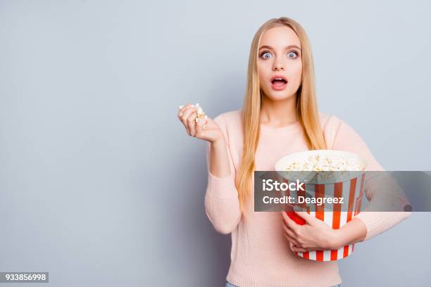 Style Stylish Trendy Person People Reaction Impressed Disbelief Concept Portrait Of Lovely Cute Pretty Girl Watching Film Int He Cinema Eating Popcorn Isolated On Gray Background Copyspace Stock Photo - Download Image Now