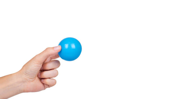 istock ping-pong ball in hand isolated on white background. copy space, template 933857024