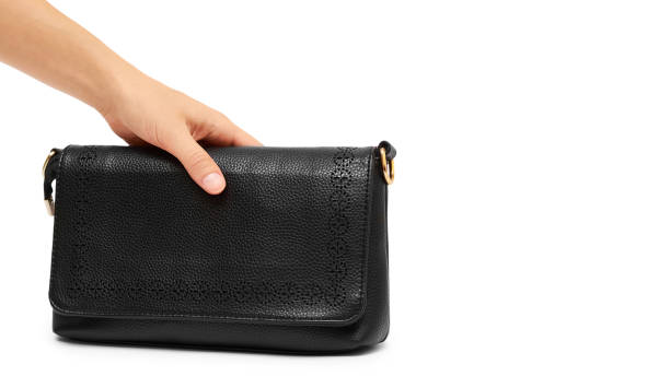 istock woman hand hold hand bag isolated on white background. copy space, template 933857192