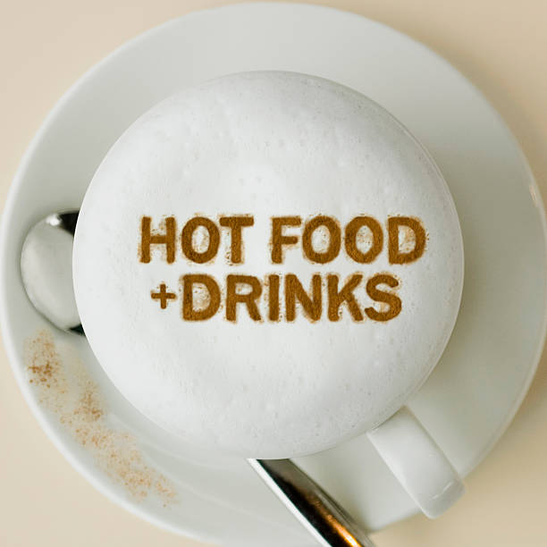 Latte with the words 'Hot food + drink' stock photo