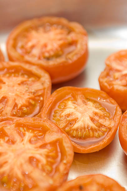 grilled tomato halves stock photo