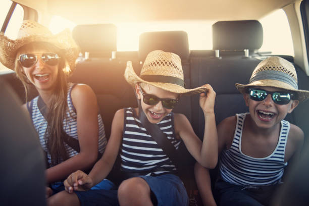 istock Kids enjoying road trip on sunny day 933862612