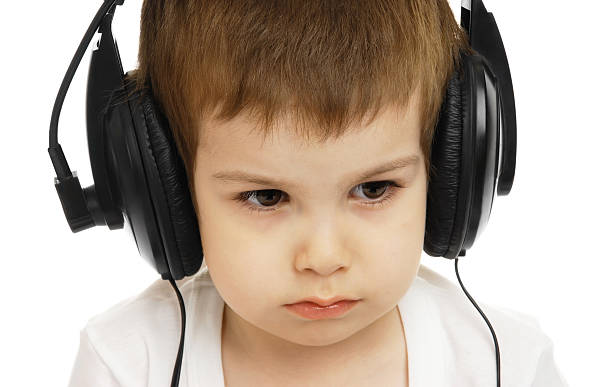 istock The child in headphones 93386376