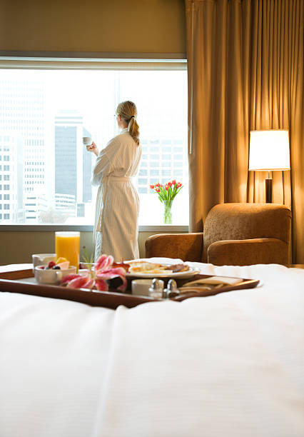 Hotel breakfast with woman in background. stock photo