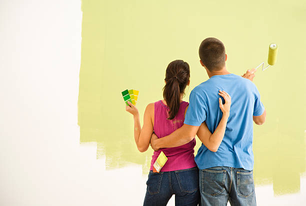 istock A young couple painting their home together 93388190