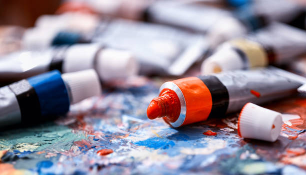 Authentic paint brushes still life on table in art class school. stock photo