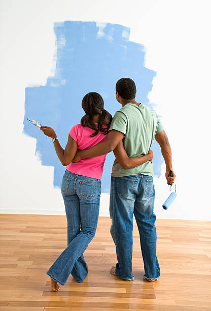 istock Man and woman looking at paint job. 93388644