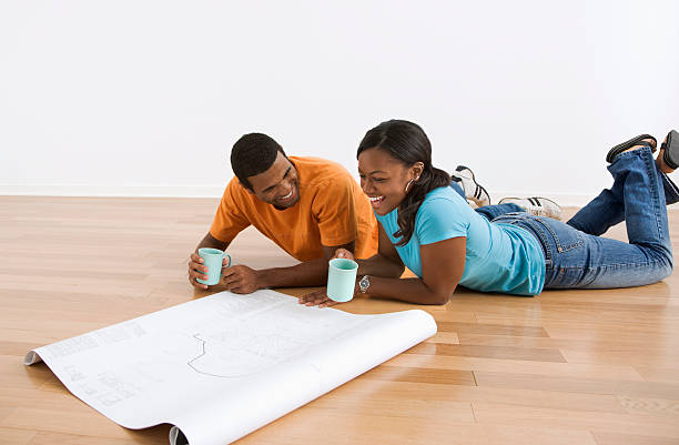 Couple with blueprints. stock photo