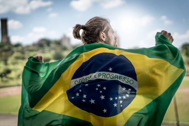 istock Brazilian fan watching a soccer game 933894344
