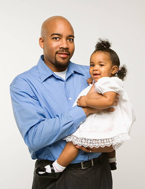 istock Man holding infant girl. 93389538