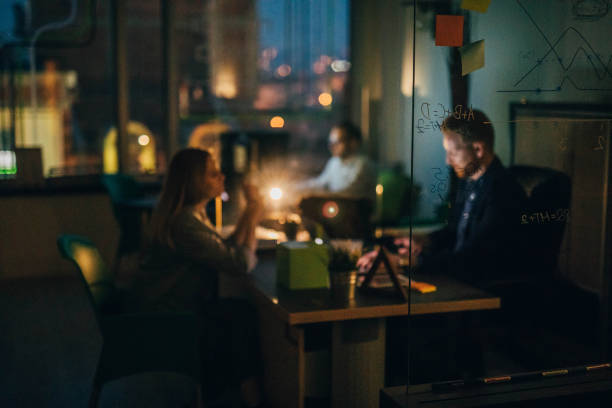istock Business team working late in the office 933896552