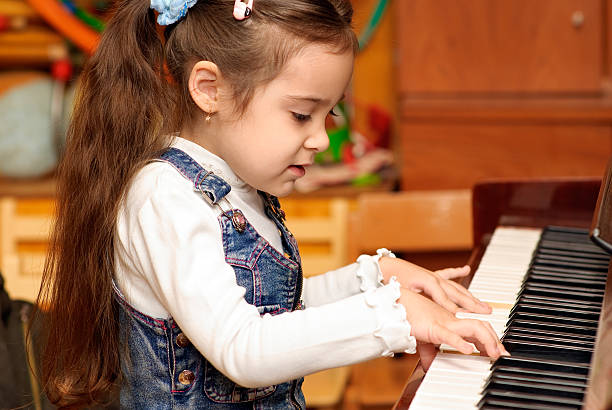 istock Girl plays piano 93390189