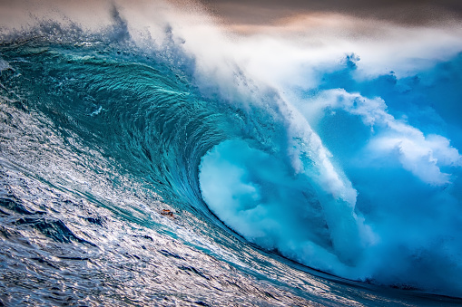 Blue ocean waves abstract background. Rough sea water during stormy weather. Surface of sea wave splash