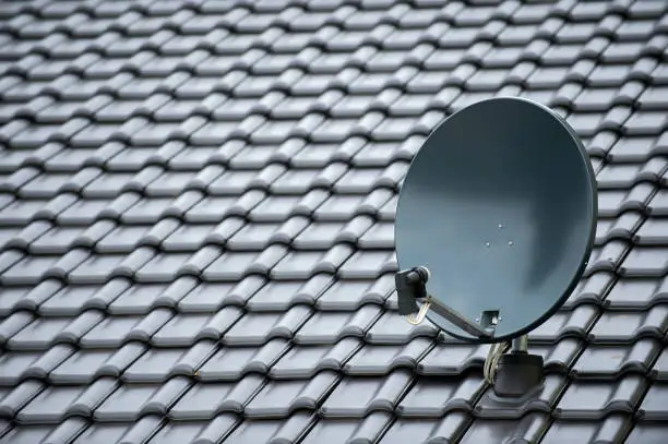 Photo of satellite dish on a new black roof