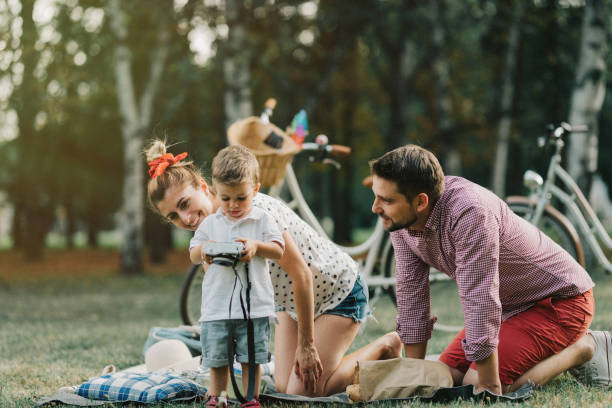 istock Family picnic in the park 933909352