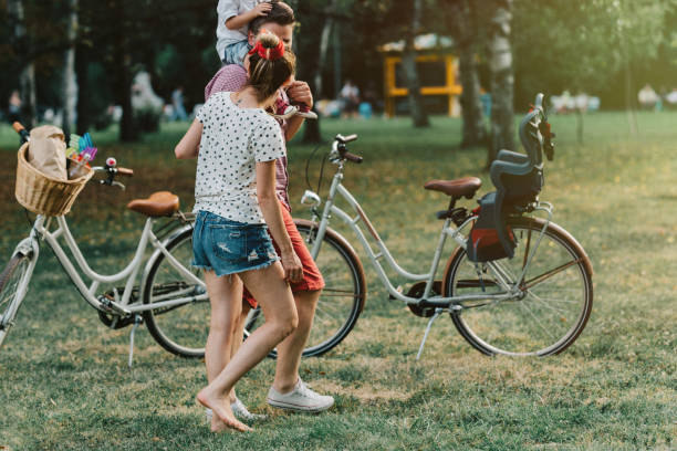 istock Happy family in the park 933909368