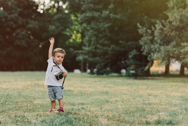 cute child plays the photographer