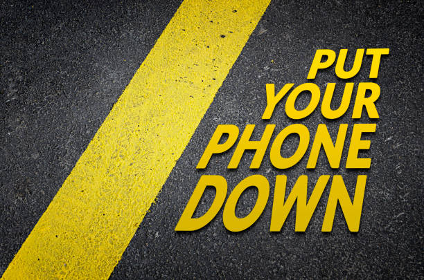 Put your phone down Put your phone down road sign concept put down stock pictures, royalty-free photos & images