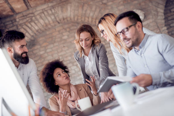 istock Group of business people working on business project 933919644