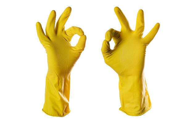 ok signe jaune, de gants en caoutchouc - sterilely photos et images de collection