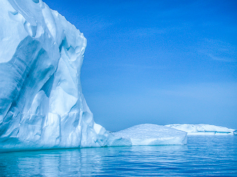 Icebergs and flows floating off the shore of Antarctica.\n\nTaken in Neko Harbor, Antarctica