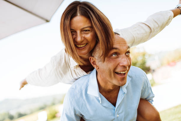 istock happiness couple piggyback 933932472