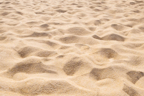 impression de fond magnifique plage de sable. texture sable brown - sandy brown photos photos et images de collection