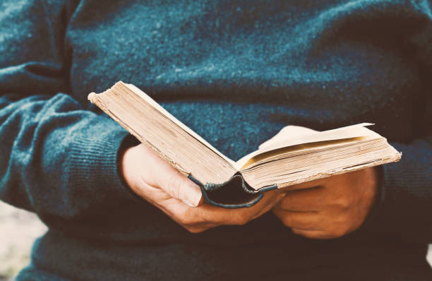 Senior woman reading an old book