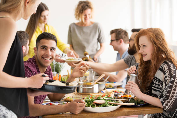 istock Friends eating healthy dinner 933940012