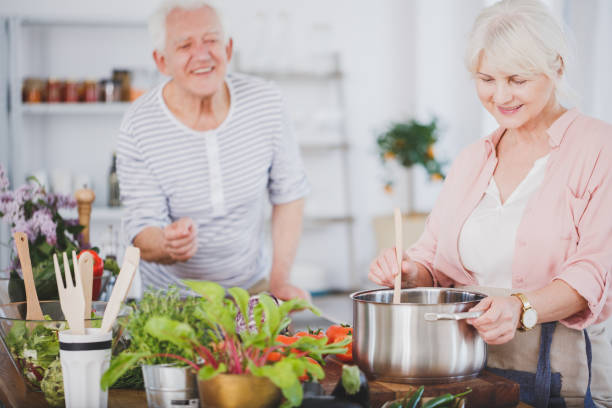 istock Senior woman preparing a meal 933940190