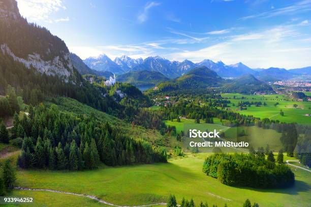 Famous Neuschwanstein Castle Visible In The Distance Located On A Rugged Hill Above The Village Of Hohenschwangau In Southwest Bavaria Germany Stock Photo - Download Image Now