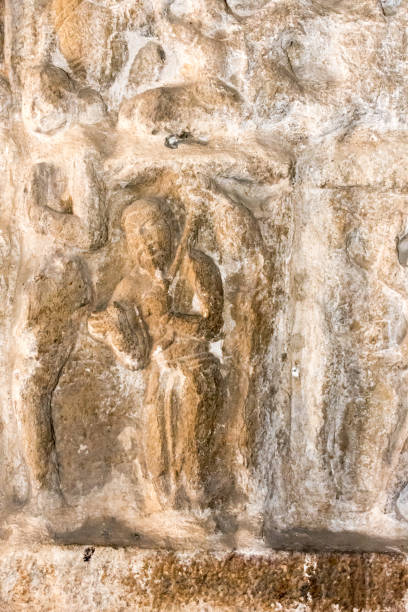 istock Sculpture of Xuanzang visiting India, in a dilapidated state 933972348