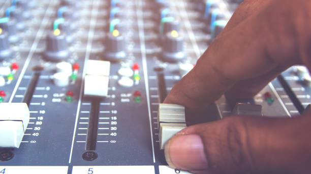 istock The DJ's hand is adjusting the volume mixer. 933985686