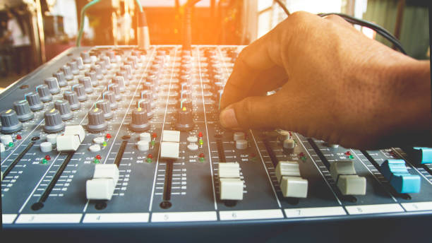 istock The DJ's hand is adjusting the volume mixer. 933985724