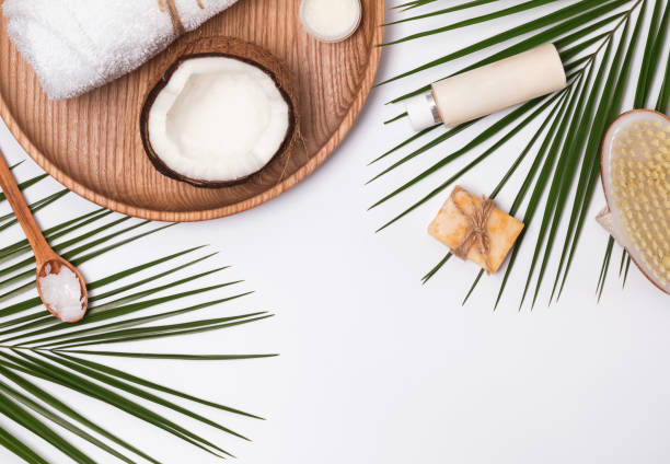 istock Body care producs, coconut and green leaves 934003922