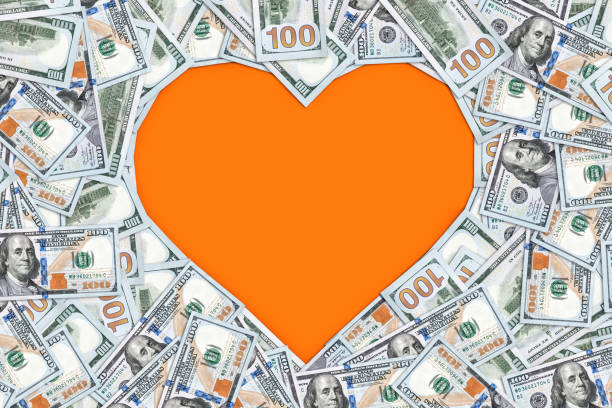 istock Heart shape sign with 100 dollar banknotes. Valentine concept background 934020128